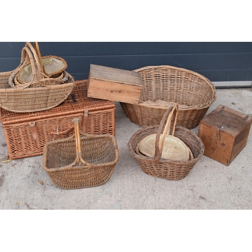 291 - A collection of vintage wicker baskets and wooden boxes of various forms