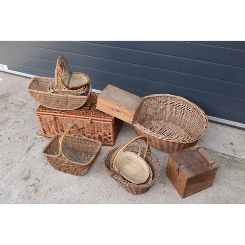 291 - A collection of vintage wicker baskets and wooden boxes of various forms