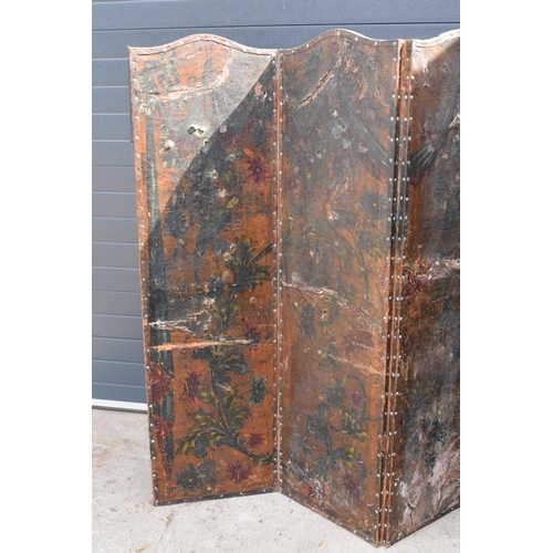 292 - A late 19th / early 20th century folding leather screen depicting birds amongst foliage. Requires at... 