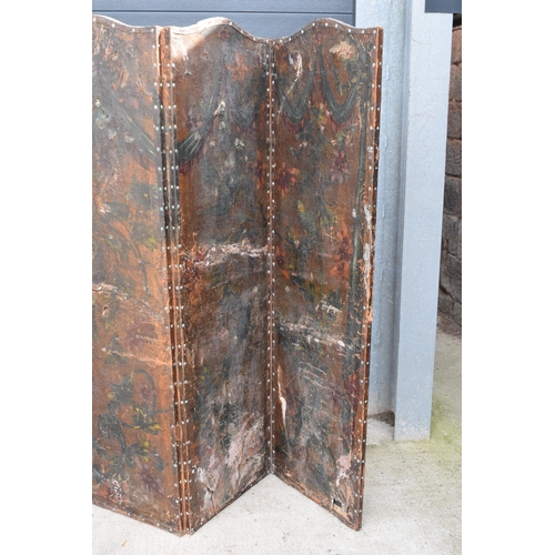 292 - A late 19th / early 20th century folding leather screen depicting birds amongst foliage. Requires at... 