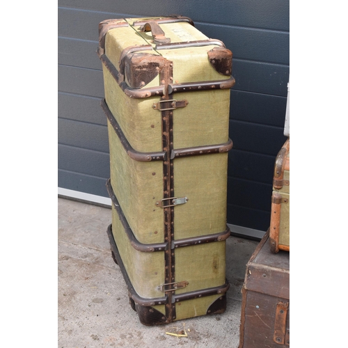 293 - A good collection of vintage trunks and suit cases to include leather and similar examples. Largest ... 