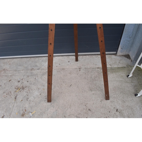 295 - An early 20th century large wooden freestanding folding easel. In good functional condition. Some ol... 