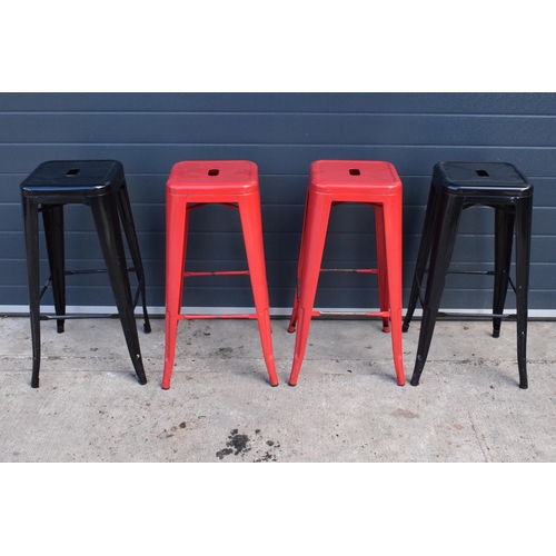 307 - A collection of industrial style metal stacking stools (4). 76cm tall. In good functional condition ... 