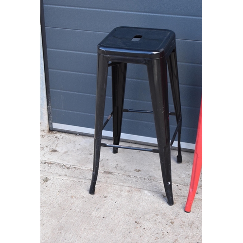 307 - A collection of industrial style metal stacking stools (4). 76cm tall. In good functional condition ... 