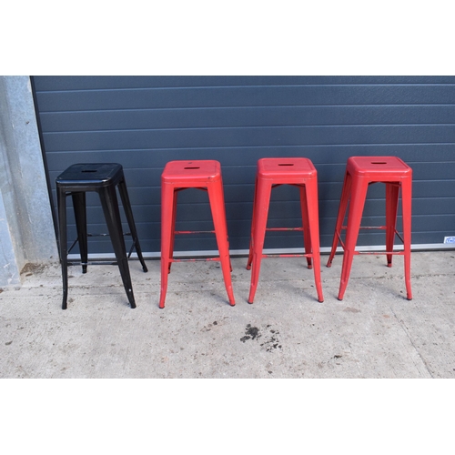 308 - A collection of industrial style metal stacking stools (4). 76cm tall. In good functional condition ... 