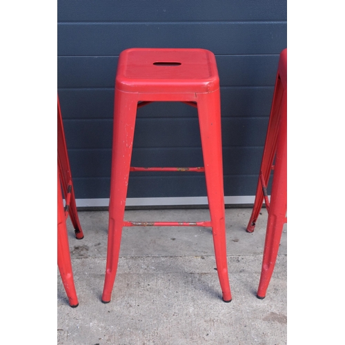 308 - A collection of industrial style metal stacking stools (4). 76cm tall. In good functional condition ... 