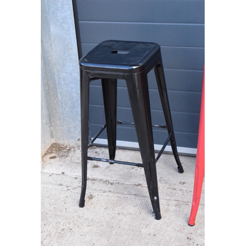 308 - A collection of industrial style metal stacking stools (4). 76cm tall. In good functional condition ... 