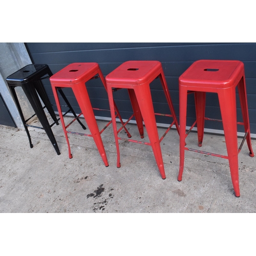 308 - A collection of industrial style metal stacking stools (4). 76cm tall. In good functional condition ... 