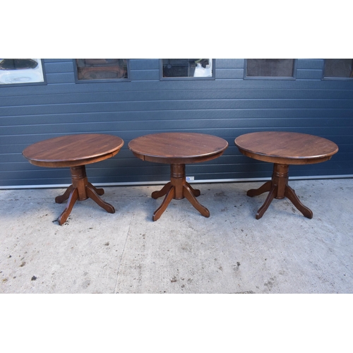 310 - A collection of large late 20th century wooden circular table, ideal for a pub / restaurant. 105cm d... 