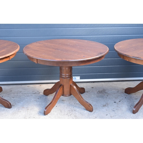 310 - A collection of large late 20th century wooden circular table, ideal for a pub / restaurant. 105cm d... 