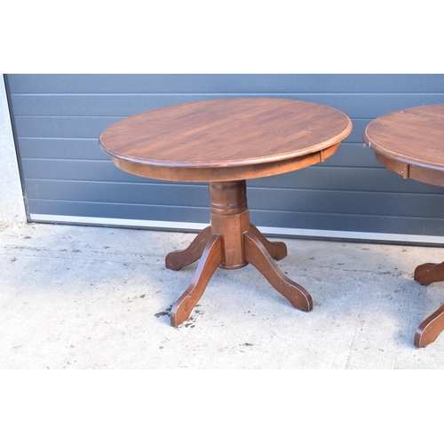 310 - A collection of large late 20th century wooden circular table, ideal for a pub / restaurant. 105cm d... 