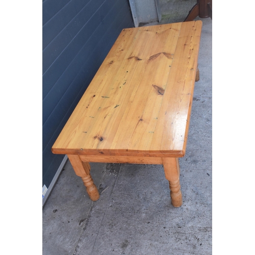 311 - A 20th century solid low pine side table / coffee table. 152 x 70 x 51cm tall. In good functional co... 