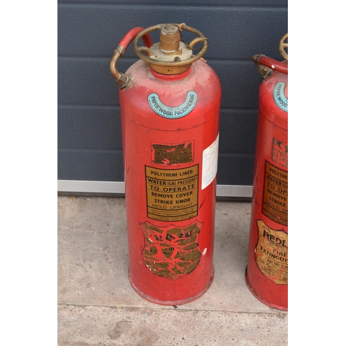 314 - A pair of 1970s Redlam Fire Extinguishers (2) (with some contents). 60cm tall. NO POSTAGE