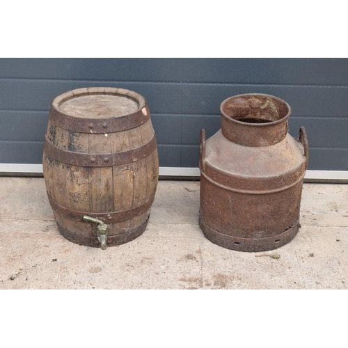 315 - A vintage metal milk churn together with a coopered wooden barrel (2). In good functional condition ... 