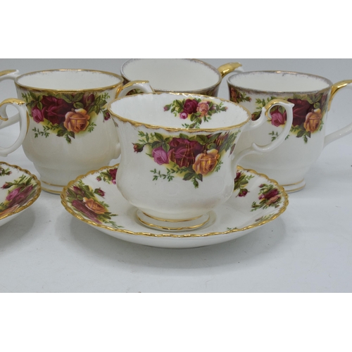 56 - A collection of Royal Albert Old Country Roses items to include 2 breakfast cups and saucers, 5 mugs... 