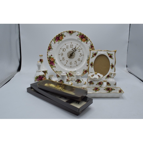 57 - A collection of Royal Albert Old Country Roses items to include a photo frame, clock plate, cruets, ... 