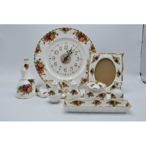 57 - A collection of Royal Albert Old Country Roses items to include a photo frame, clock plate, cruets, ... 