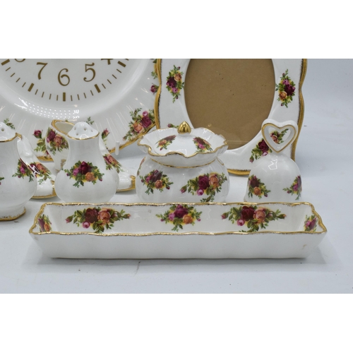 57 - A collection of Royal Albert Old Country Roses items to include a photo frame, clock plate, cruets, ... 