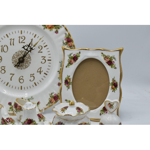 57 - A collection of Royal Albert Old Country Roses items to include a photo frame, clock plate, cruets, ... 