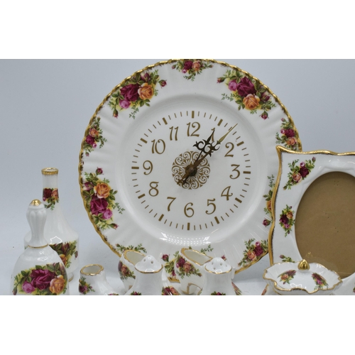 57 - A collection of Royal Albert Old Country Roses items to include a photo frame, clock plate, cruets, ... 