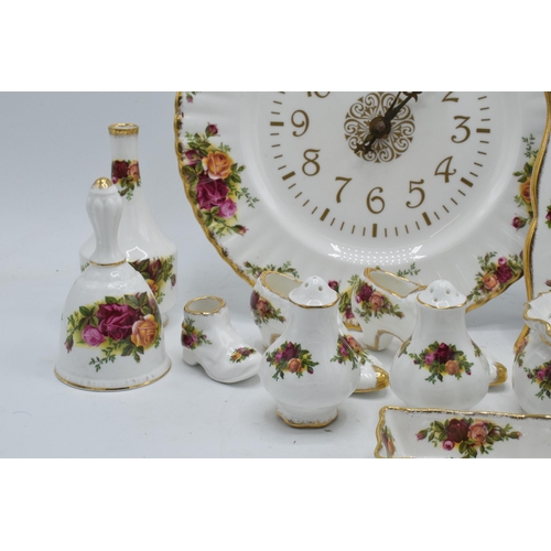 57 - A collection of Royal Albert Old Country Roses items to include a photo frame, clock plate, cruets, ... 