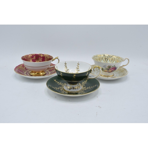 59 - A collection of cups and saucers / duos to include Aysnley and Paragon depicting regal style scenes ... 