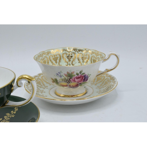 59 - A collection of cups and saucers / duos to include Aysnley and Paragon depicting regal style scenes ... 