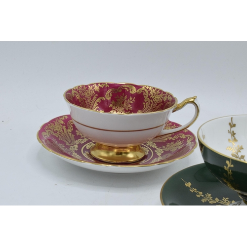 59 - A collection of cups and saucers / duos to include Aysnley and Paragon depicting regal style scenes ... 