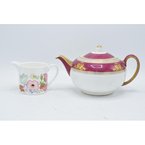 69 - A pair of Wedgwood items to include a Columbia teapot and a milk jug in the Meadow Sweet design (2).... 