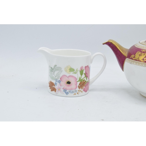 69 - A pair of Wedgwood items to include a Columbia teapot and a milk jug in the Meadow Sweet design (2).... 