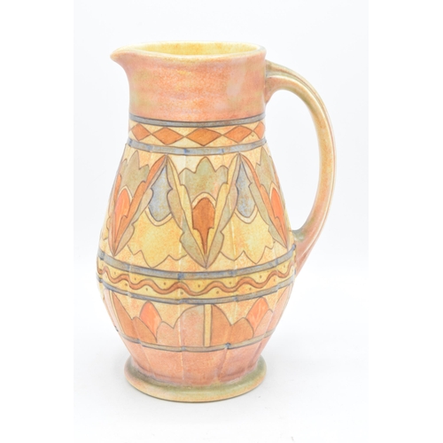 78 - A Bursley Ware Charlotte Rhead tubelined jug with number to base. 25cm tall. In good condition with ... 