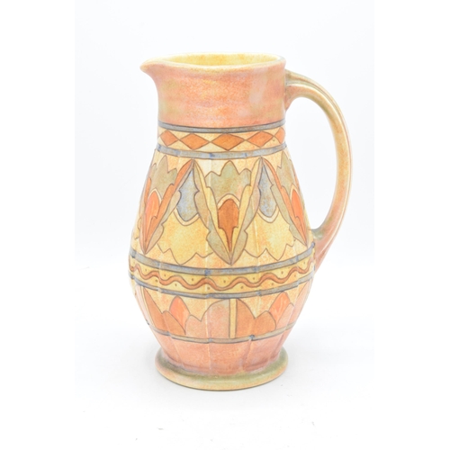 78 - A Bursley Ware Charlotte Rhead tubelined jug with number to base. 25cm tall. In good condition with ... 