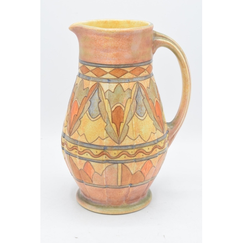 78 - A Bursley Ware Charlotte Rhead tubelined jug with number to base. 25cm tall. In good condition with ... 