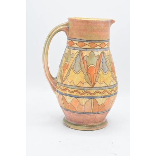 78 - A Bursley Ware Charlotte Rhead tubelined jug with number to base. 25cm tall. In good condition with ... 