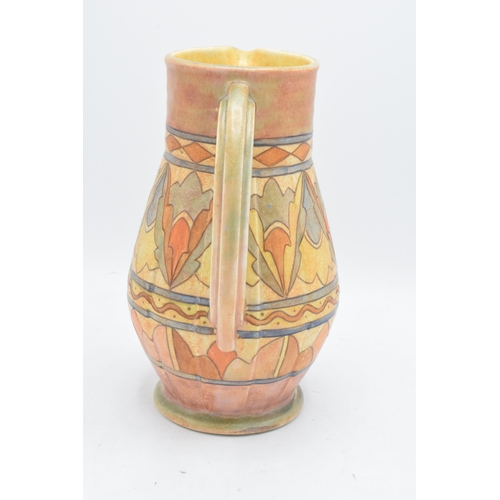 78 - A Bursley Ware Charlotte Rhead tubelined jug with number to base. 25cm tall. In good condition with ... 