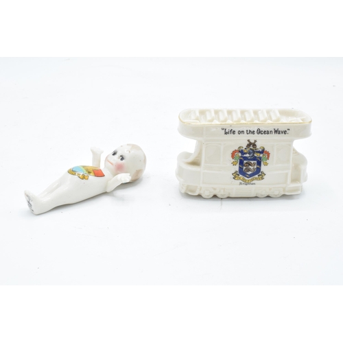 80 - A pair of Crested China items to include a Willow Art Kewpie with Warkworth crest together with a Br... 