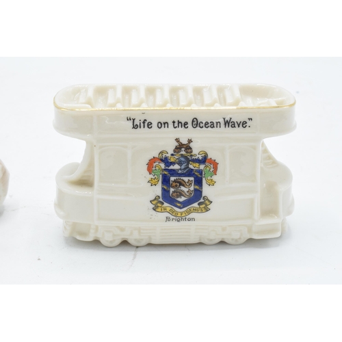 80 - A pair of Crested China items to include a Willow Art Kewpie with Warkworth crest together with a Br... 