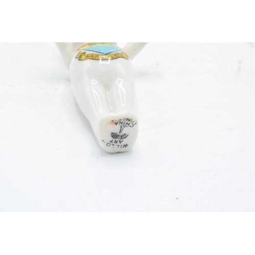 80 - A pair of Crested China items to include a Willow Art Kewpie with Warkworth crest together with a Br... 