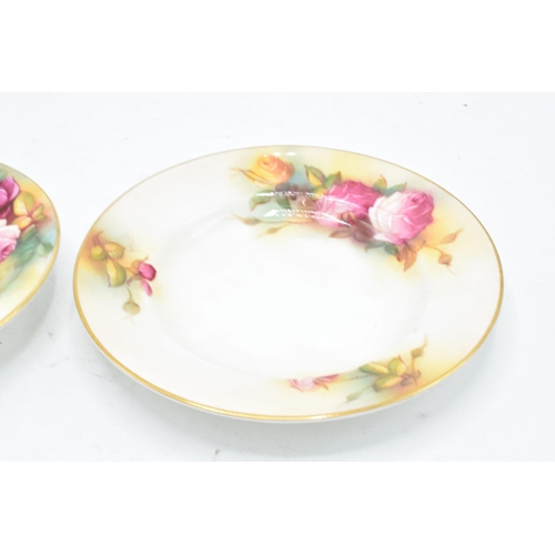 82 - A collection of Royal Worcester items to include a saucer (1936) and side plate (1938) decorated wit... 