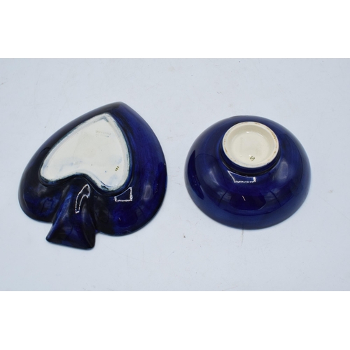 96 - A pair of Moorcroft items to include a hibiscus on blue spade-shaped ashtray together with a similar... 