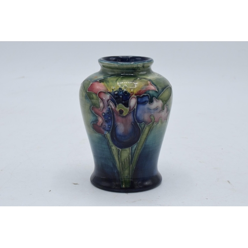 97 - Moorcroft small bulbous vase in the Orchid (or similar) design. 9cm tall. In good condition with no ... 