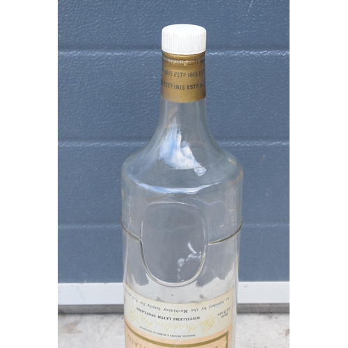 275 - Mackinlay's Old Scotch Whiskey large bottle. 48cm tall. In good condition.