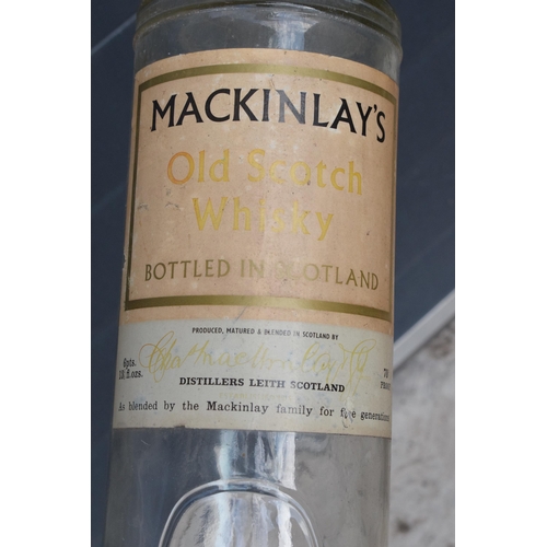 275 - Mackinlay's Old Scotch Whiskey large bottle. 48cm tall. In good condition.