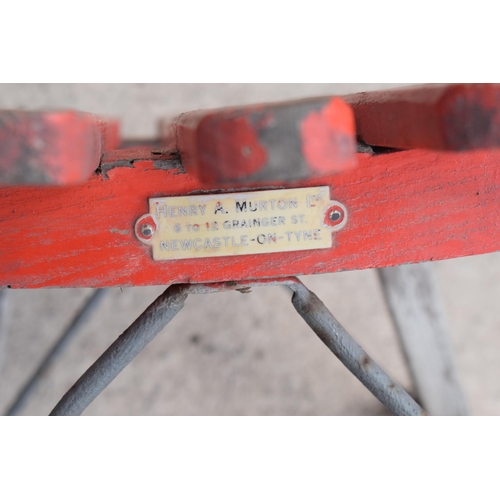 276 - A vintage wooden child's sledge painted in red by Henry A Murton of Newcastle. 82cm long. In good co... 