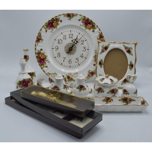 57 - A collection of Royal Albert Old Country Roses items to include a photo frame, clock plate, cruets, ... 