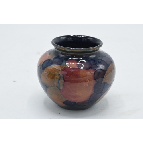 100 - Moorcroft small squat vase in the Pomegranate design. 7cm tall. In good condition with no obvious da... 
