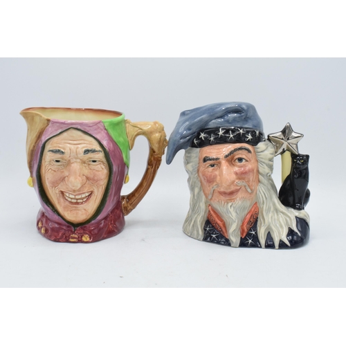 107 - A pair of large Royal Doulton character jugs to include The Wizard D6862 and Touchstone (2). In good... 