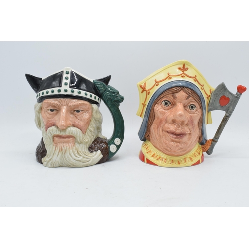 111 - A pair of large Royal Doulton character jugs to include the Red Queen D6777 and Viking D6496 (2). In... 