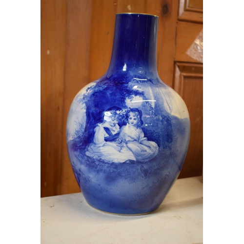 134 - Large Royal Doulton bulbous vase with Blue Children design. 30.5cm tall. In good condition with no o... 