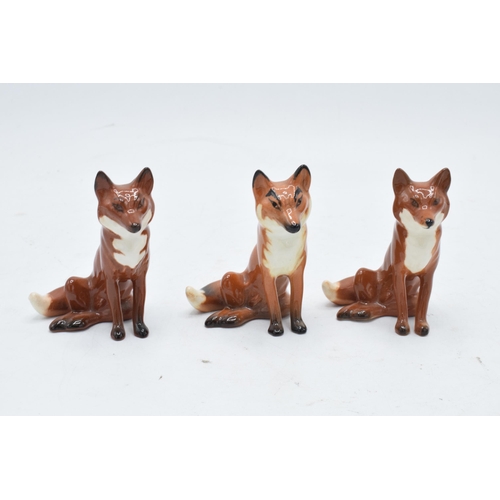 161 - A collection of Beswick foxes to include standing fox 1440 x 2 and seated fox 1748 x 3 (5) with some... 